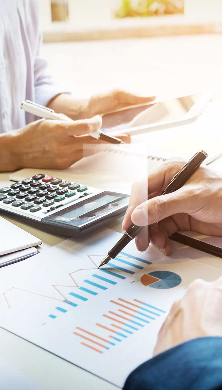 Businesspeople doing data calculations